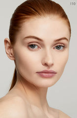 Clé de Peau Radiant Fluid Foundation applied with brush for a smooth, lightweight finish.