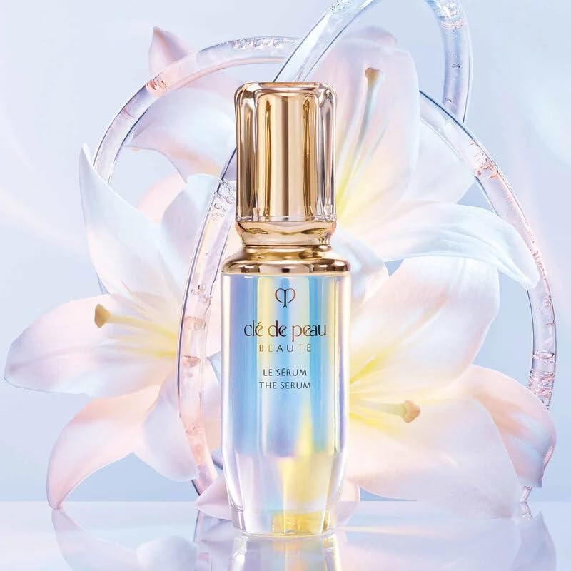 Clé de Peau Beauté The Serum Refill on a clean shelf suggests a luxurious skincare routine