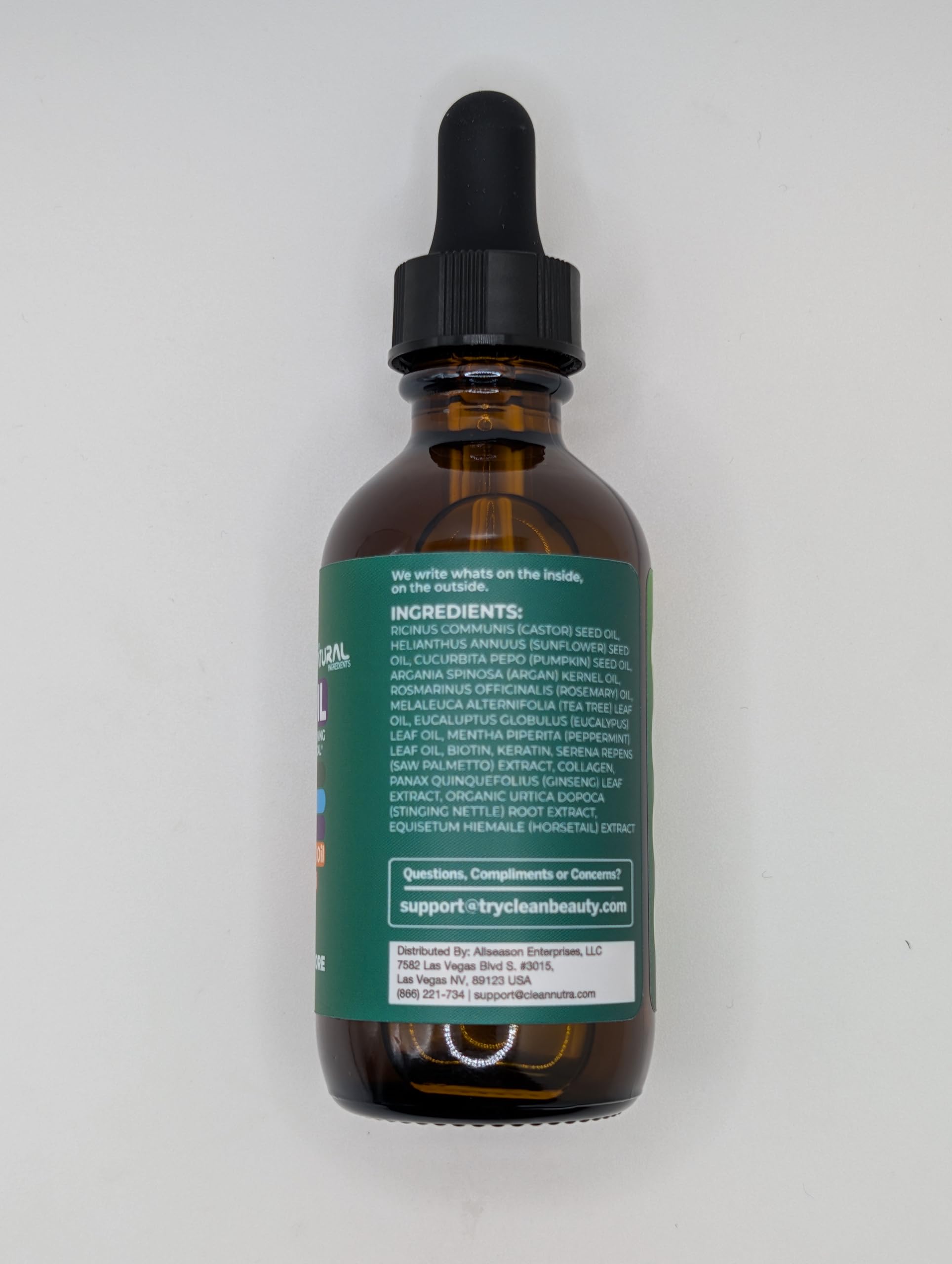 Clean Beauty packaging box with bottle on clean backdrop.