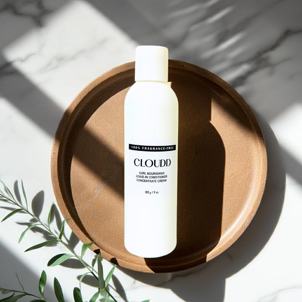 CLOUDD fragrance-free curl leave-in on wet hair delivering lightweight moisture.