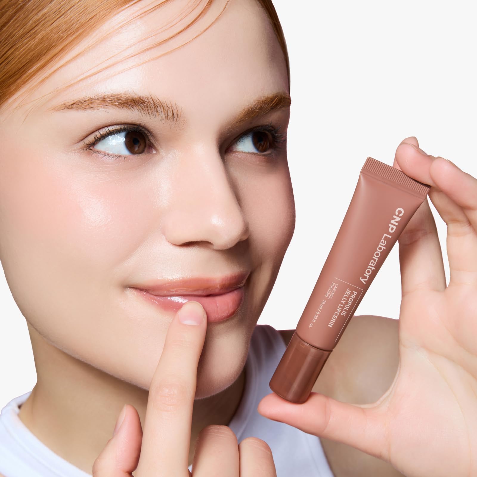 CNP Propolis Jelly Lipcerin lip swatch reveals natural caramel tint