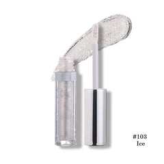 Close-up of Coalitione liquid eyeshadow glitter application gliding smoothly on lids.