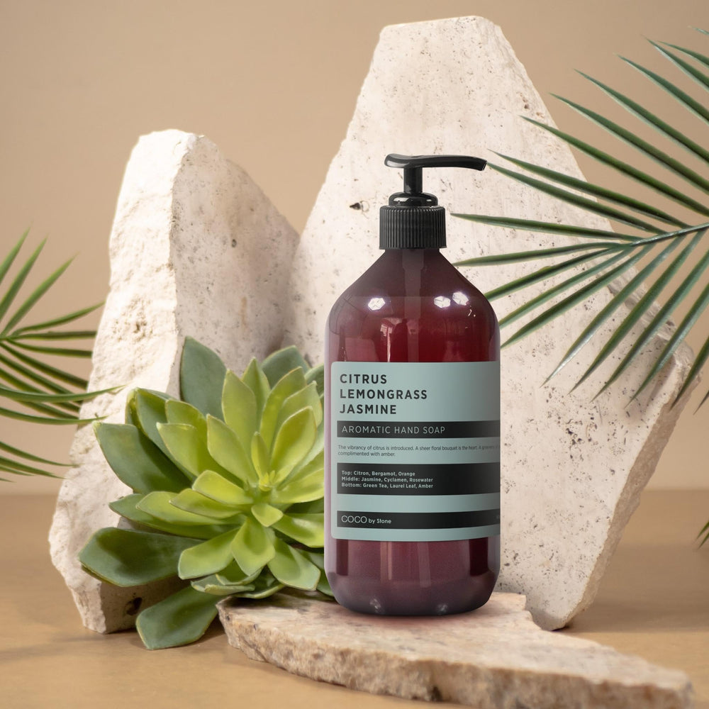 Vanity display showing COCO by Stone hand soap with bright label.