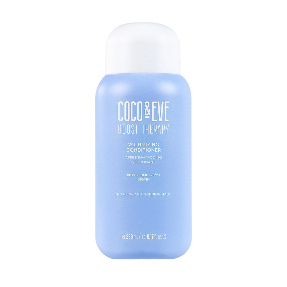 Coco & Eve Boost Therapy bottle closeup highlights biotin-enriched formula for fuller-looking hair.