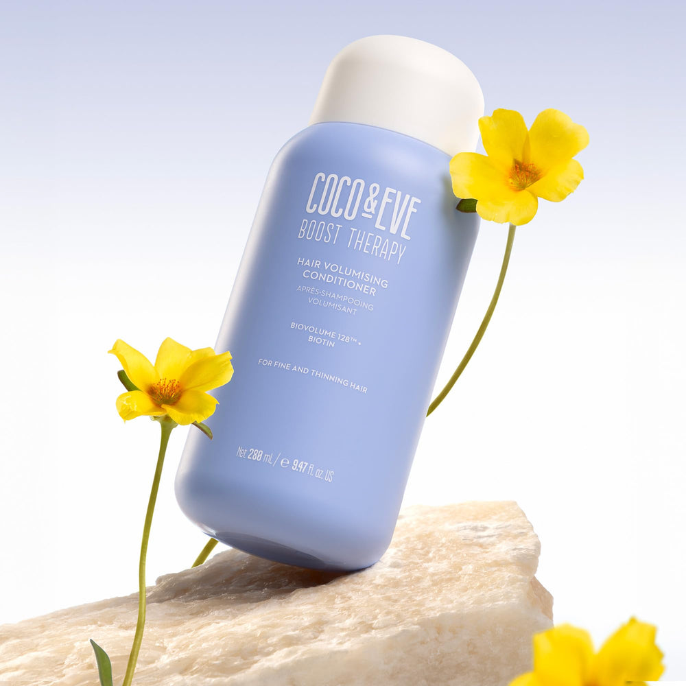 Coco & Eve Boost Therapy packaging on shelf demonstrates premium hair care appeal.