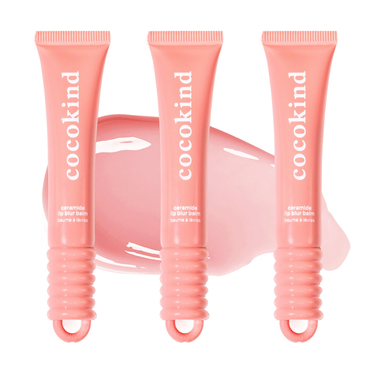 Cocokind Ceramide Lip Blur Balm in coral pink for hydrating lips and subtle shine.