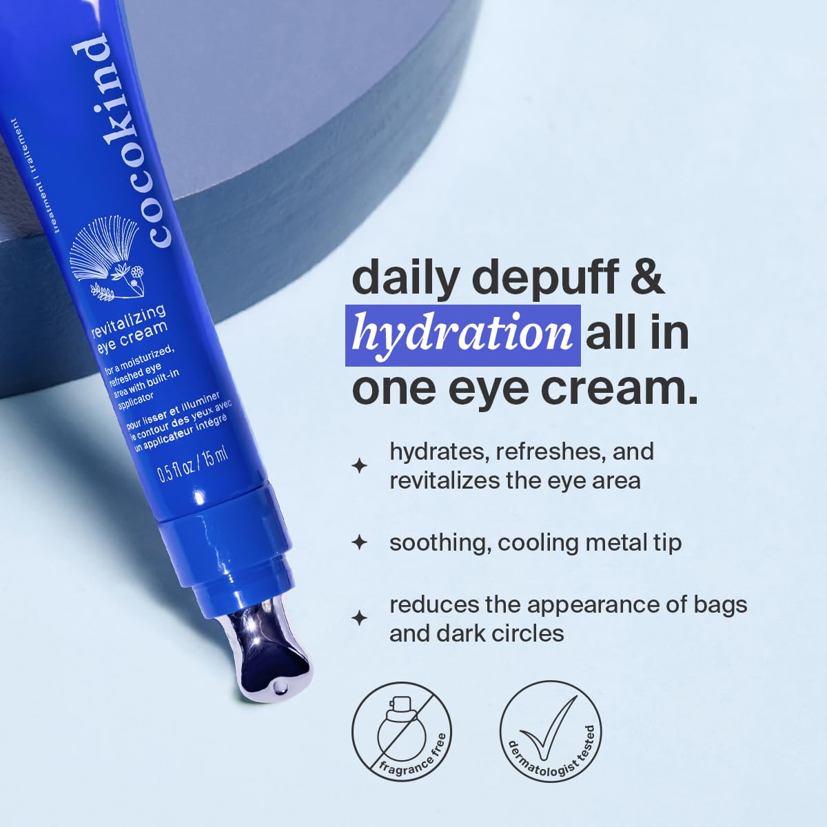Cocokind Revitalizing Eye Cream cooling metal tip in use for depuffing.