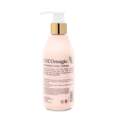 Hands applying Defining Curl Cream to detangle and define curls.