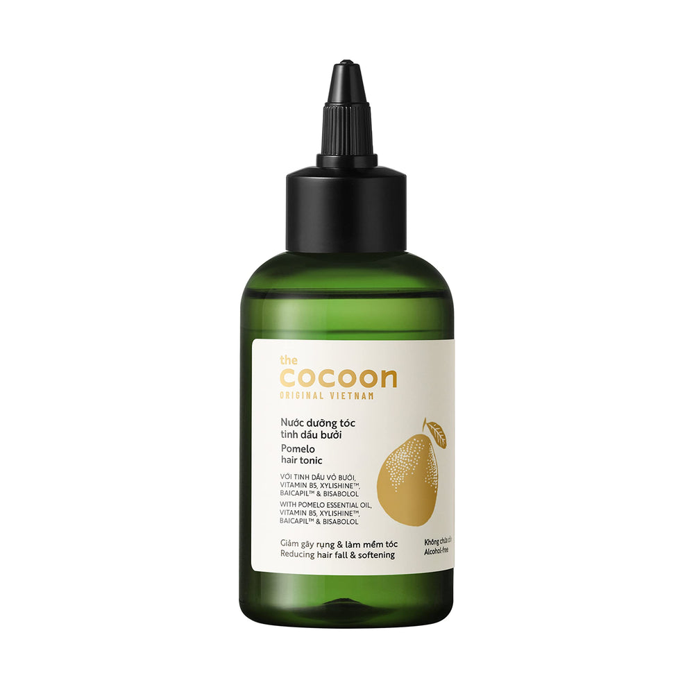 COCOONORIGINAL Cocoon Pomelo Grapefruit Hair Tonic bottle close-up, refreshing scent and vegan formula.