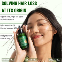 Drops on wood surface show the lightweight serum texture for scalp care.