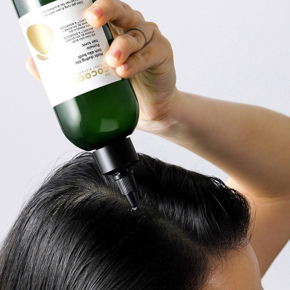 Cocoon Original Pomelo Oil Hair Tonic on thinning hair scalp view.