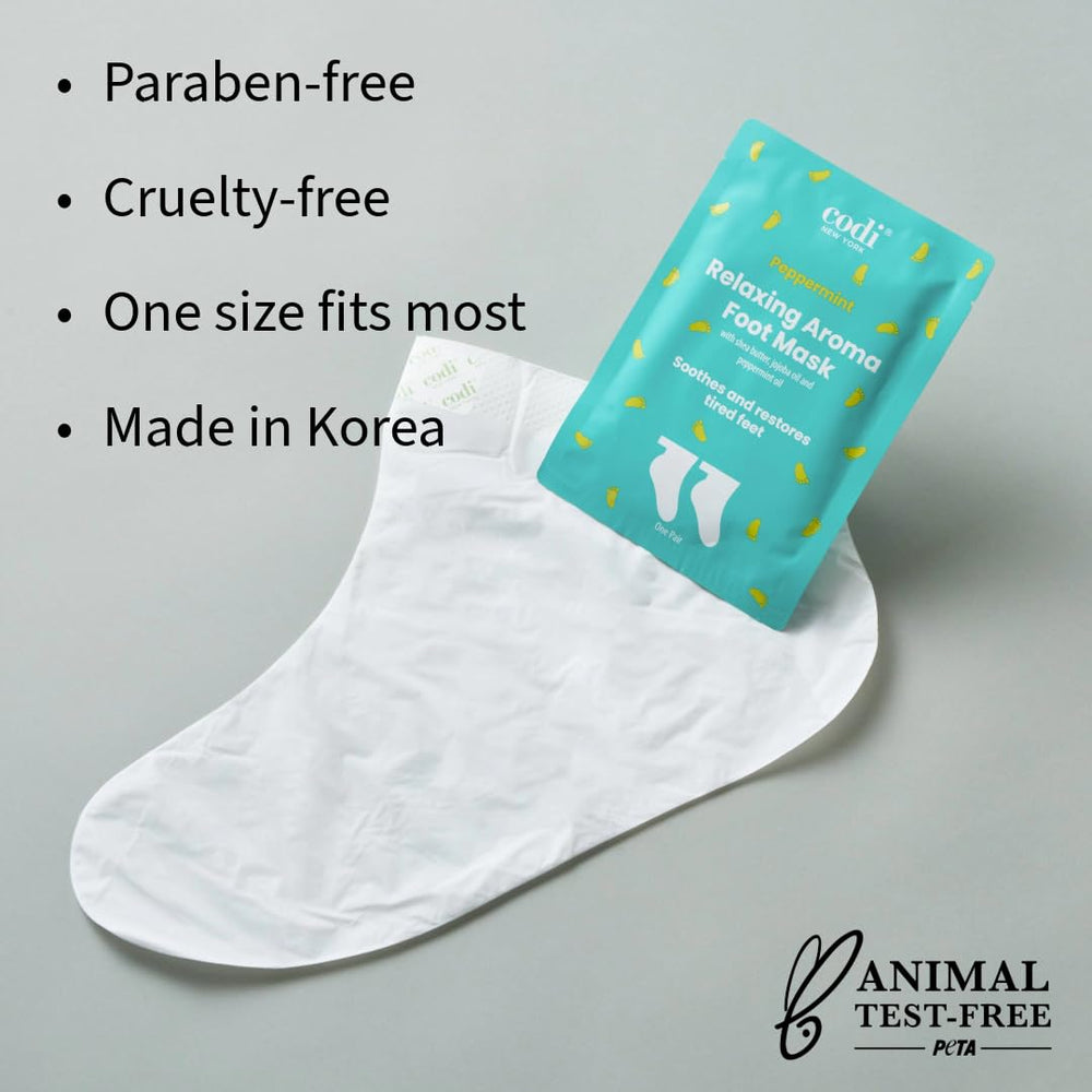 Codi New York Relaxing Aroma Foot Mask pedicure socks on feet during treatment