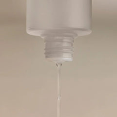 Colleen Rothschild Gentle & Clear Toner being applied with a cotton pad for gentle exfoliation