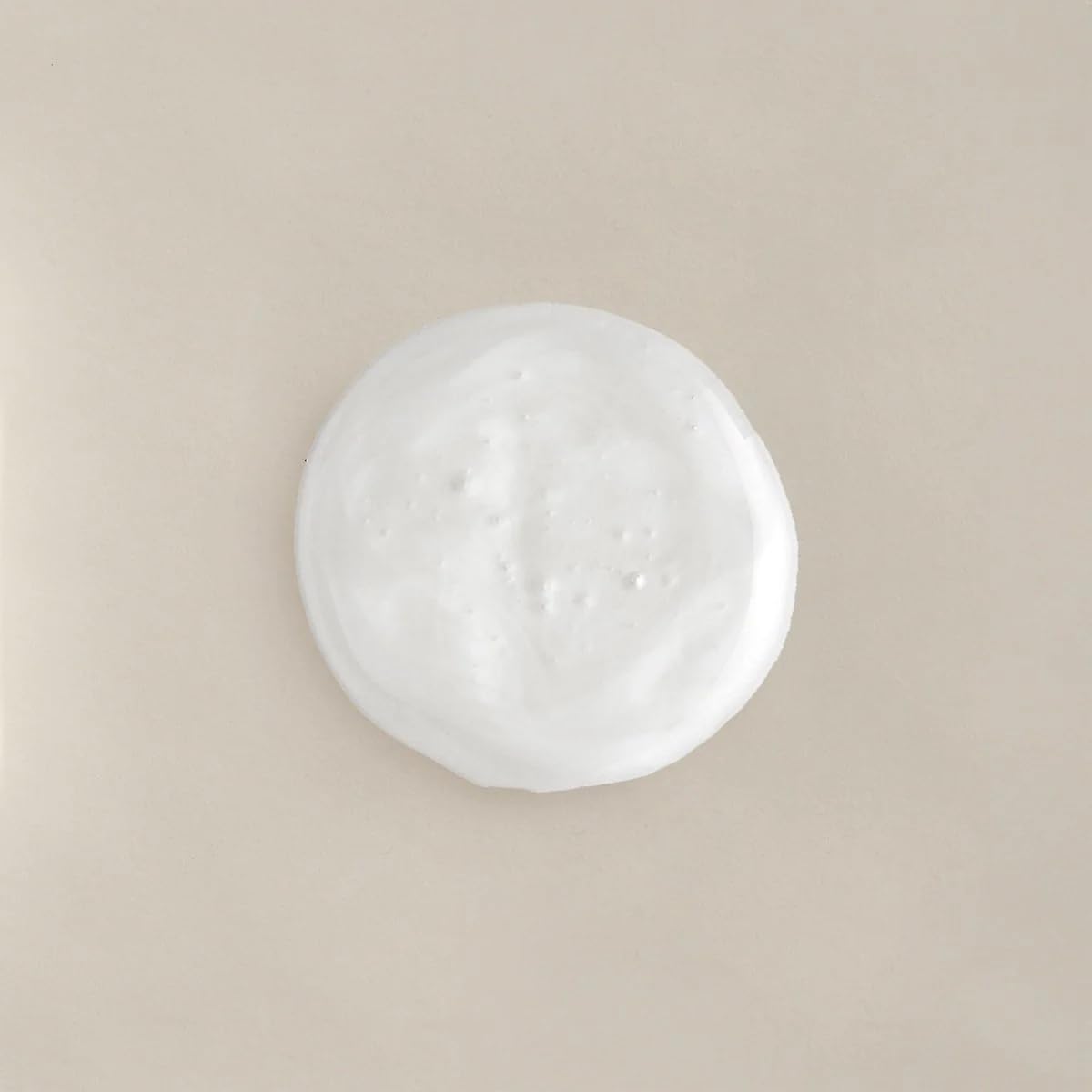 COLLEEN ROTHSCHILD Renew & Replenish Shampoo bottle close-up highlights biotin for stronger strands.