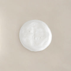 COLLEEN ROTHSCHILD Renew & Replenish Shampoo bottle close-up highlights biotin for stronger strands.