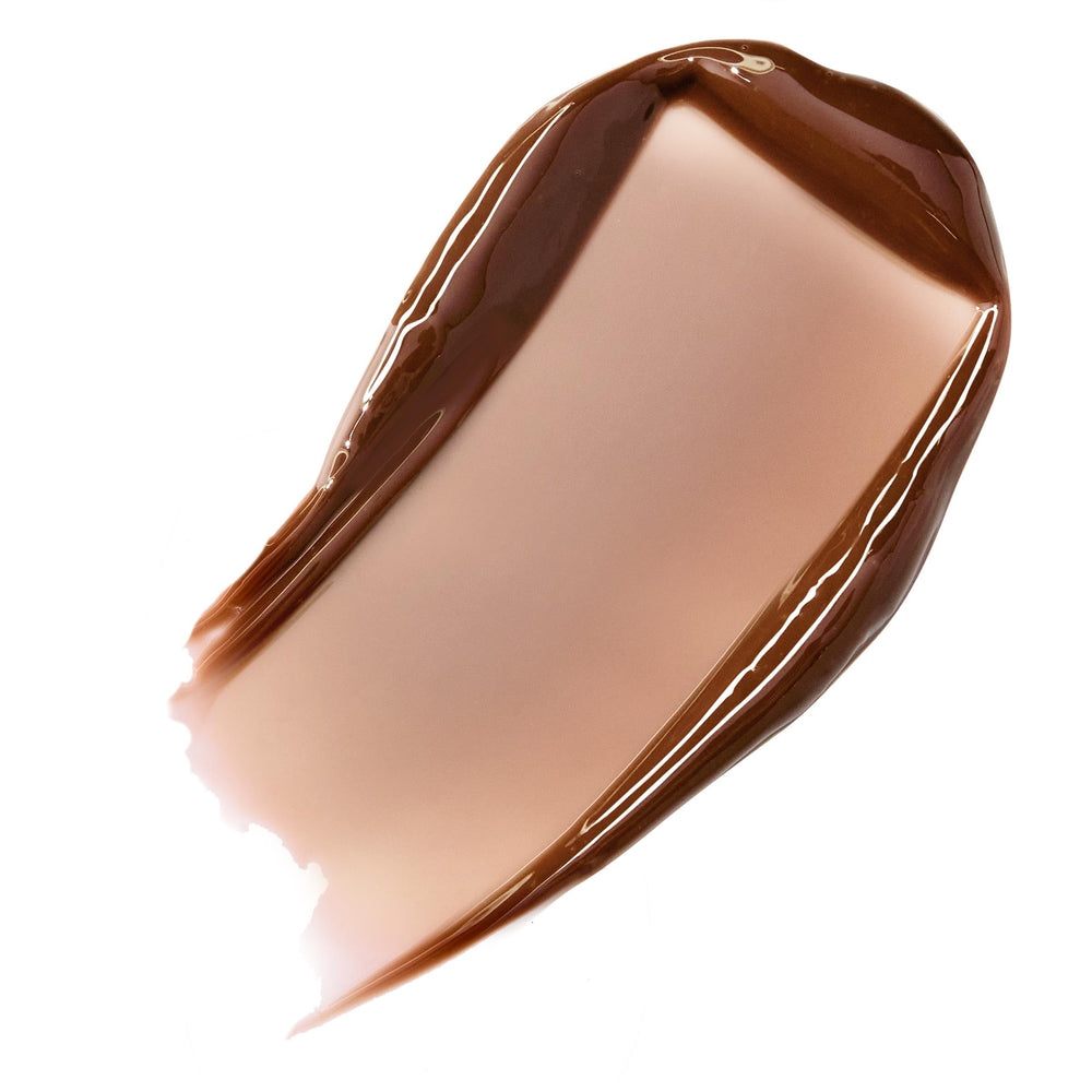 ColourPop Fresh Kiss Glossy Lip Balm during application swipe highlights cushiony moisture.