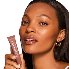 ColourPop Fresh Kiss Glossy Lip Balm close-up shows a shiny, moisturizing finish.