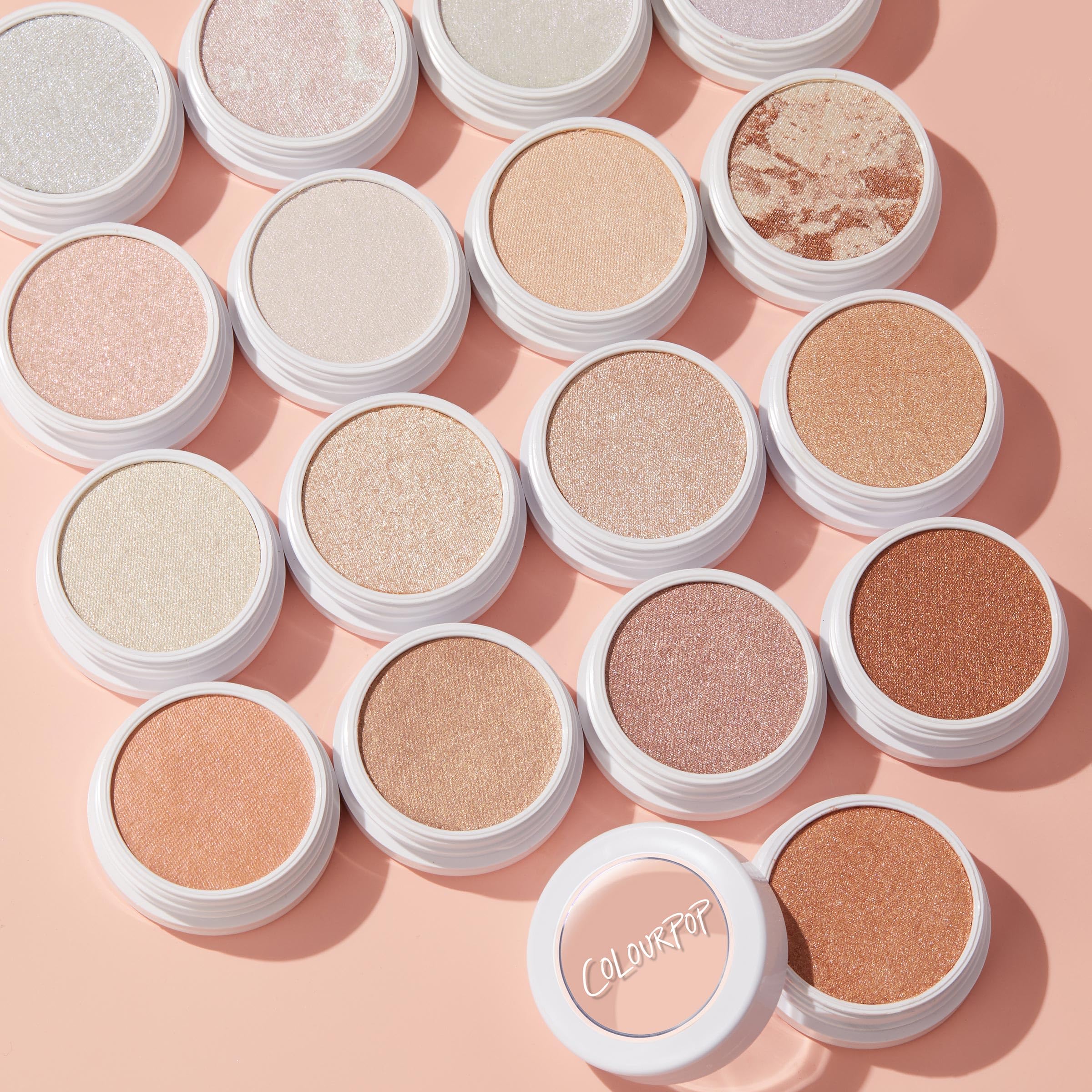 ColourPop Lunch Money Highlighter glow with a pink-neutral tint for radiant skin.