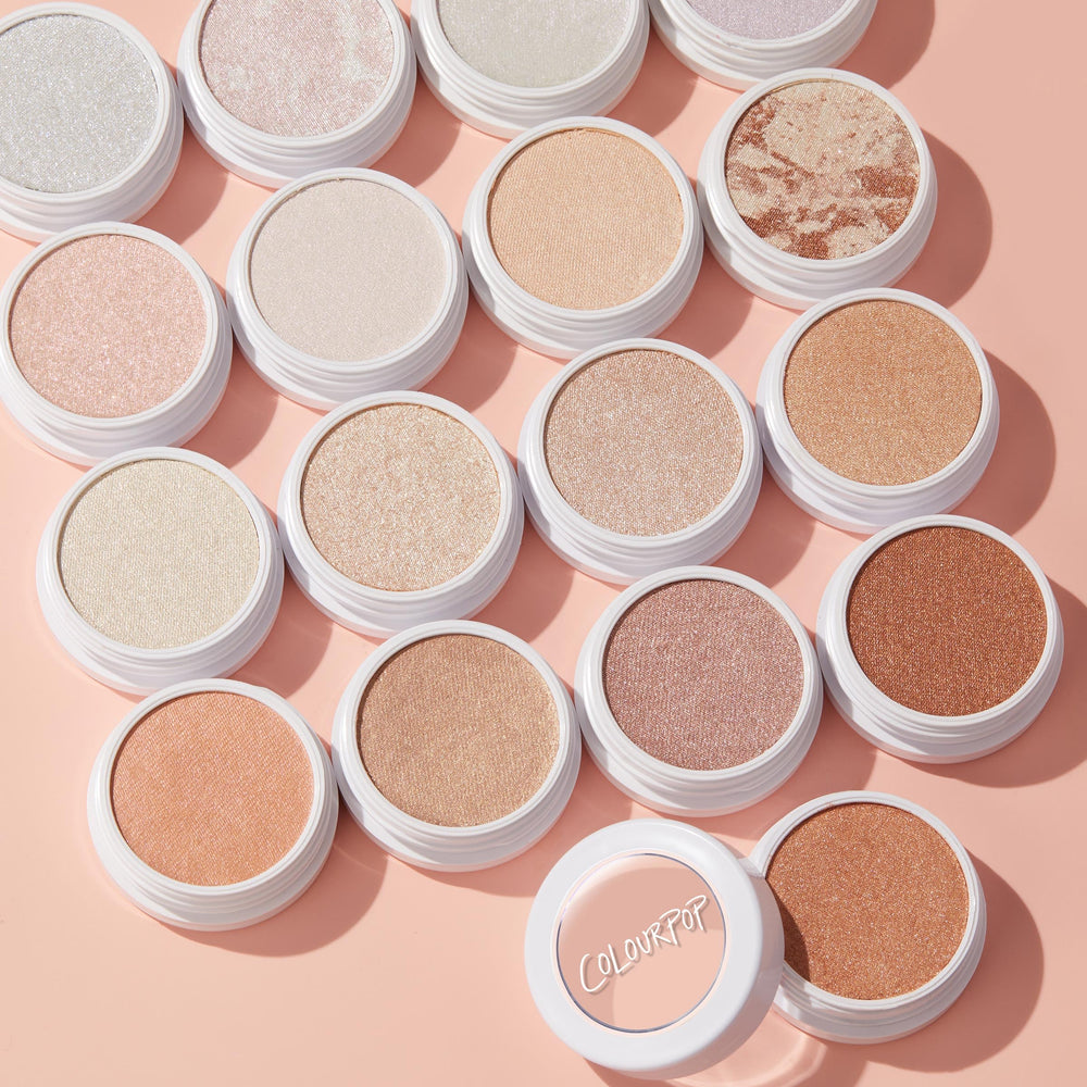 ColourPop Lunch Money Highlighter glow with a pink-neutral tint for radiant skin.