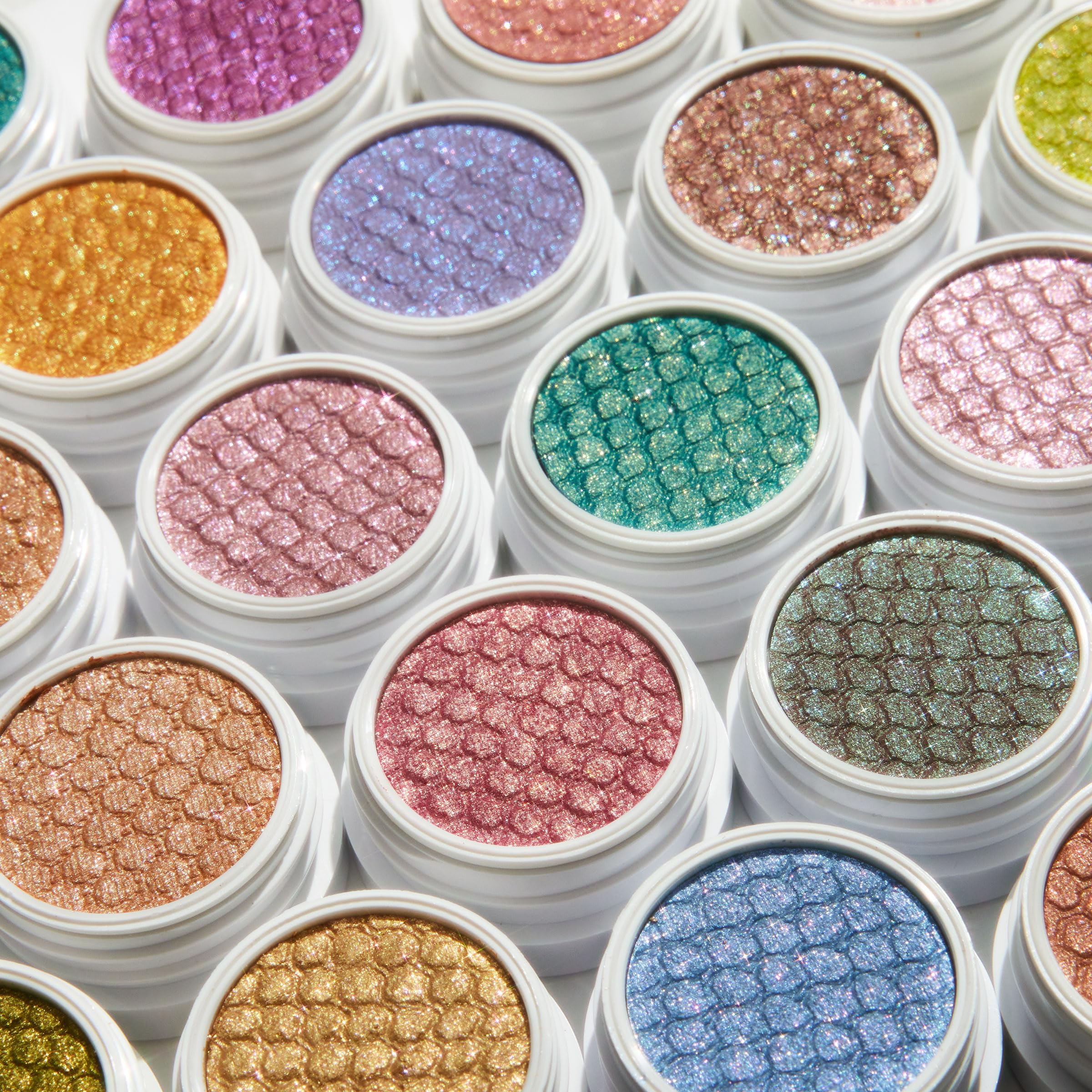 Closeup of ColourPop Super Shock Shadow glitter texture on eyelid.