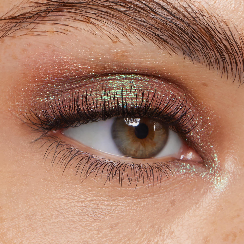 Fingertip application of ColourPop Super Shock Shadow for full coverage.