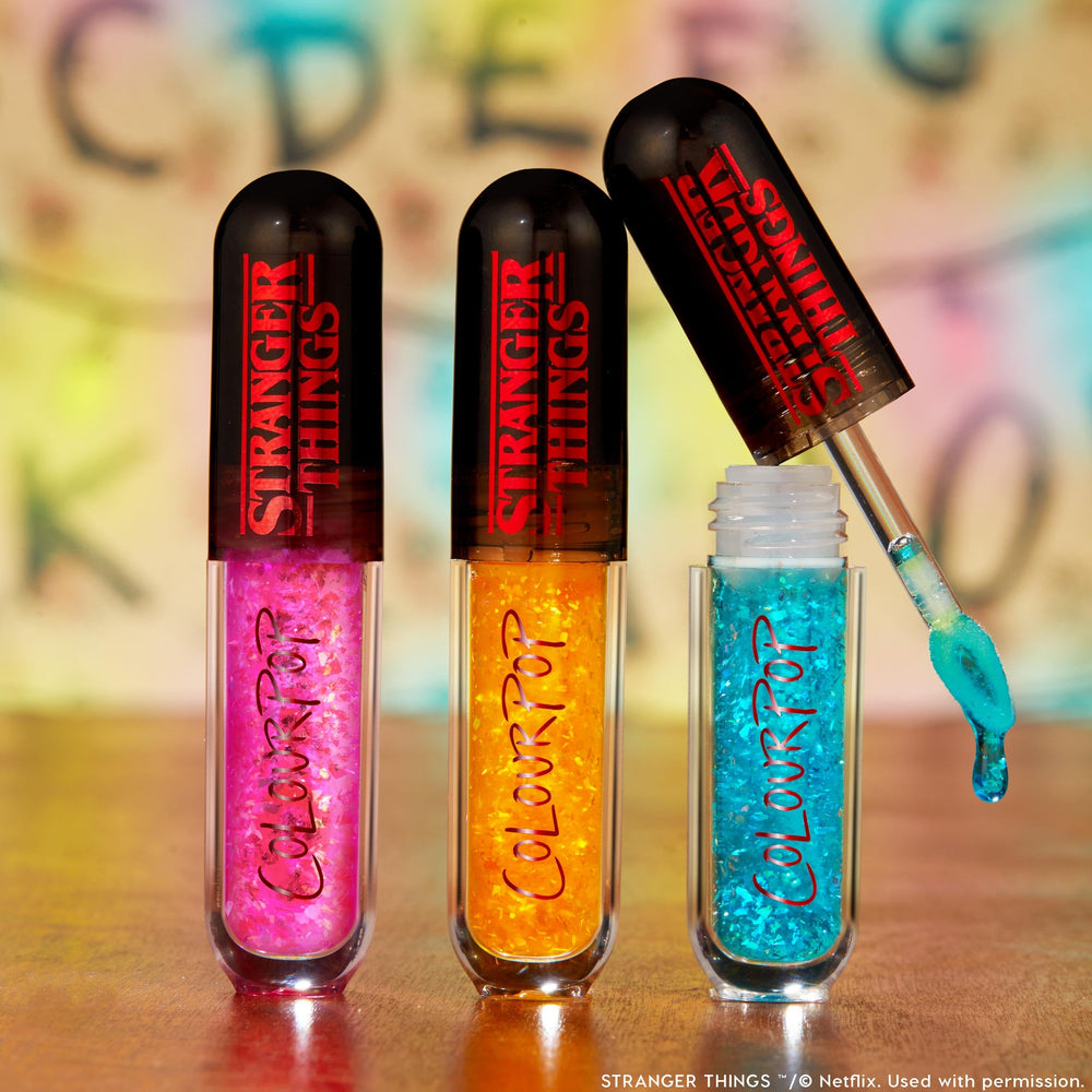 ColourPop Talk to Me gloss with multichrome flakes for dimensional shine.