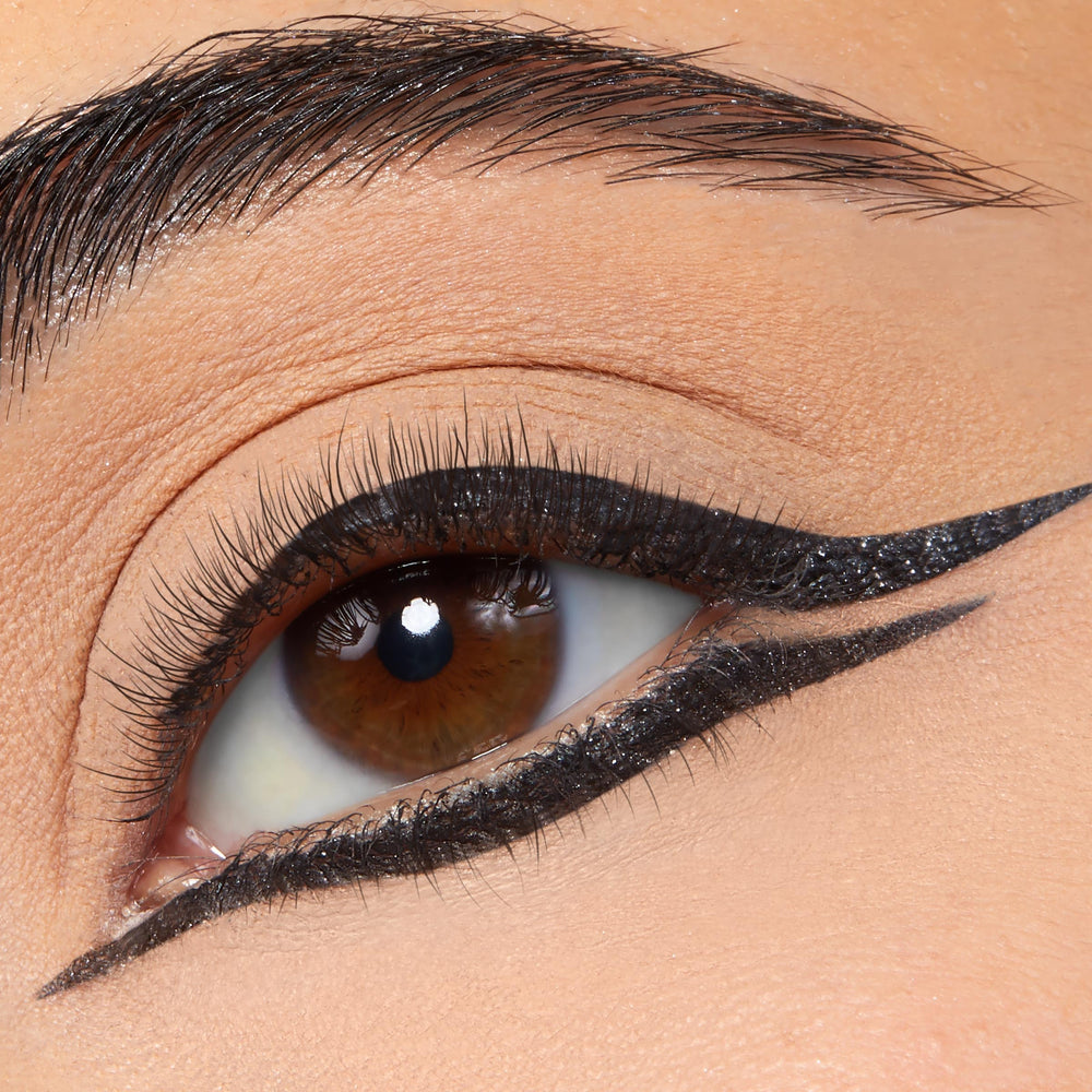 ColourPop Twilight Graphix Ink Liner Coven bottle in action during a liner stroke.