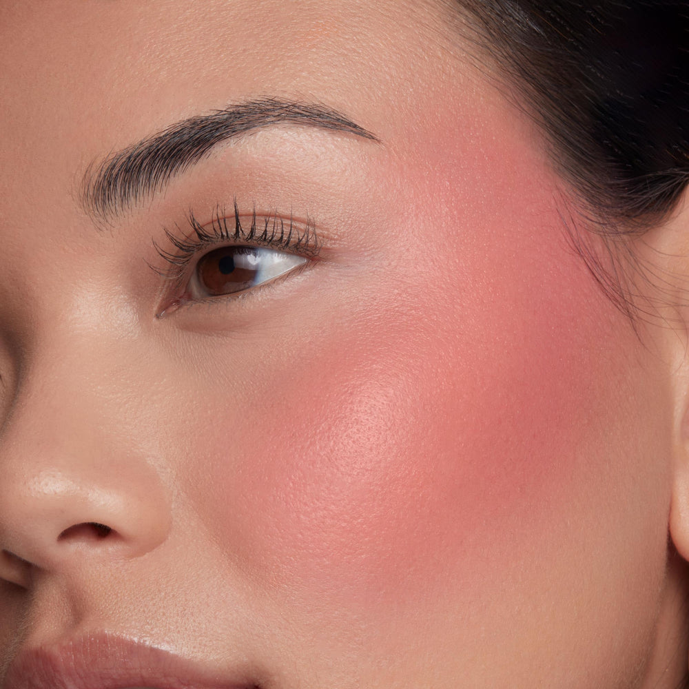 ColourPop Weightless Liquid Blush on cheek delivers a luminous glow.