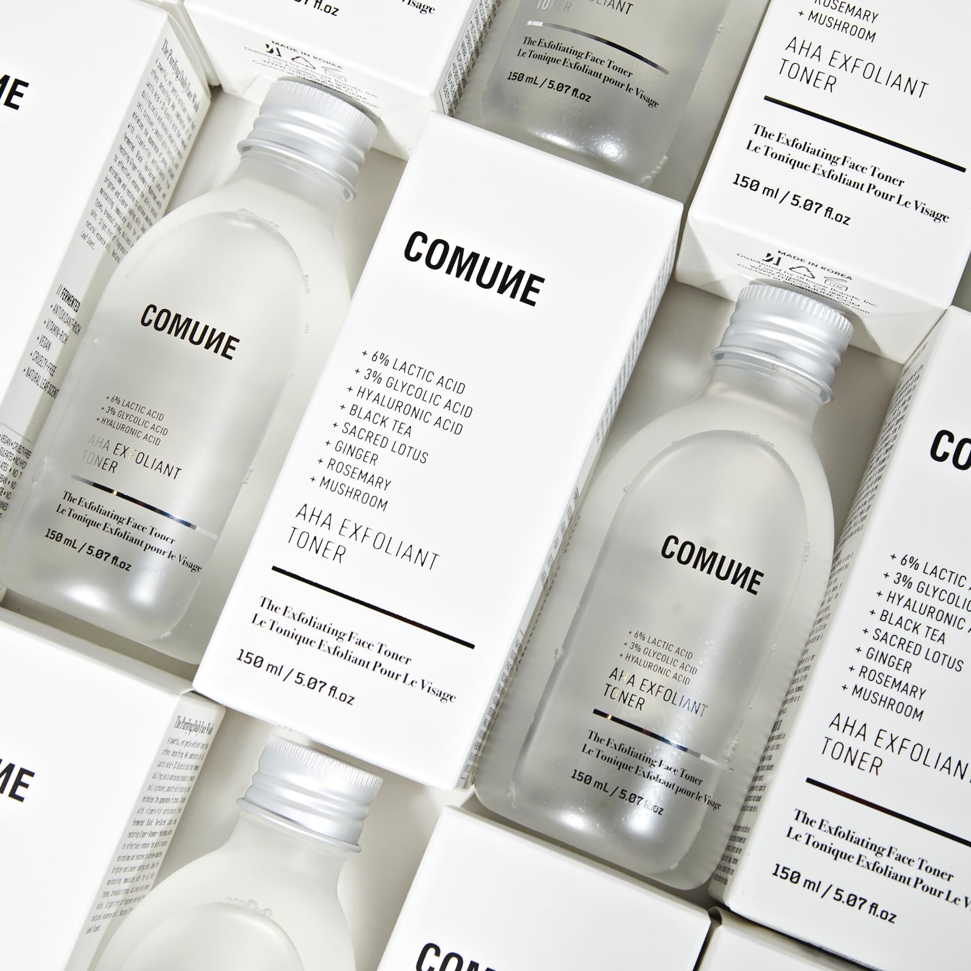 COMUNE AHA Exfoliant Toner box and bottle product shot.