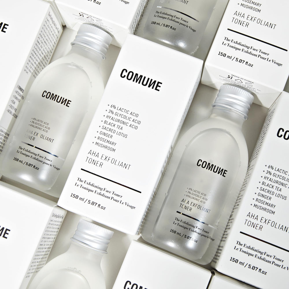 COMUNE AHA Exfoliant Toner box and bottle product shot.