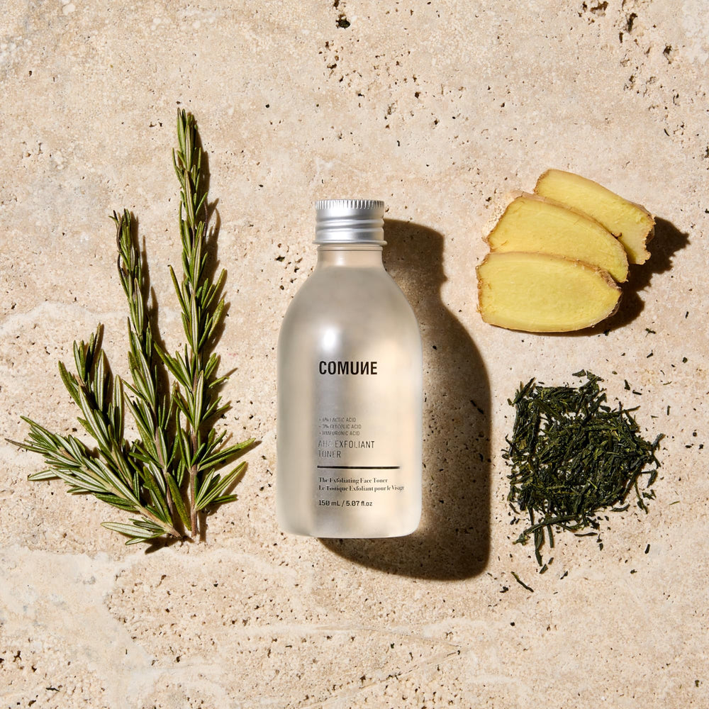 COMUNE AHA Exfoliant Toner pour shot suggesting even texture.