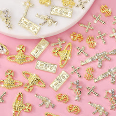 COOSLIM gun nail charms provide edgy sparkle for bold nail designs.