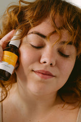 Cosmedica Vitamin C Super Serum on hand demonstrates silky texture.