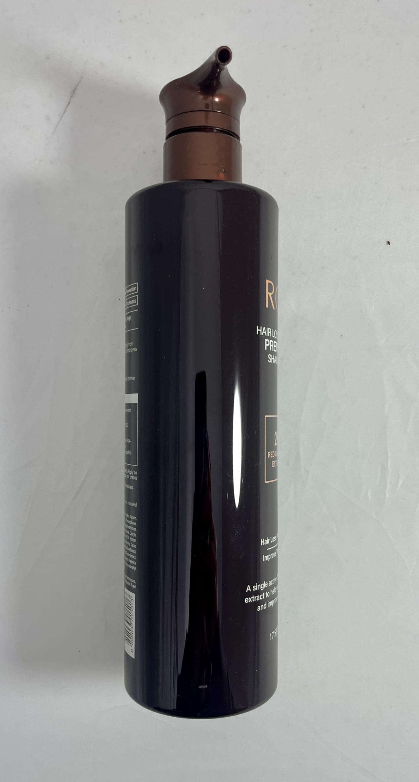 COSMOCOS RG3 shampoo on bathroom counter for routine use.