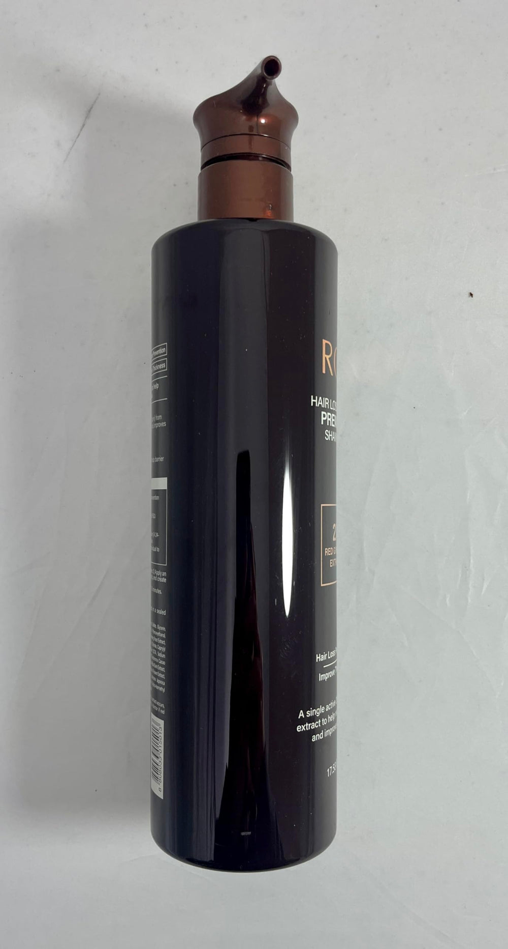 COSMOCOS RG3 shampoo on bathroom counter for routine use.