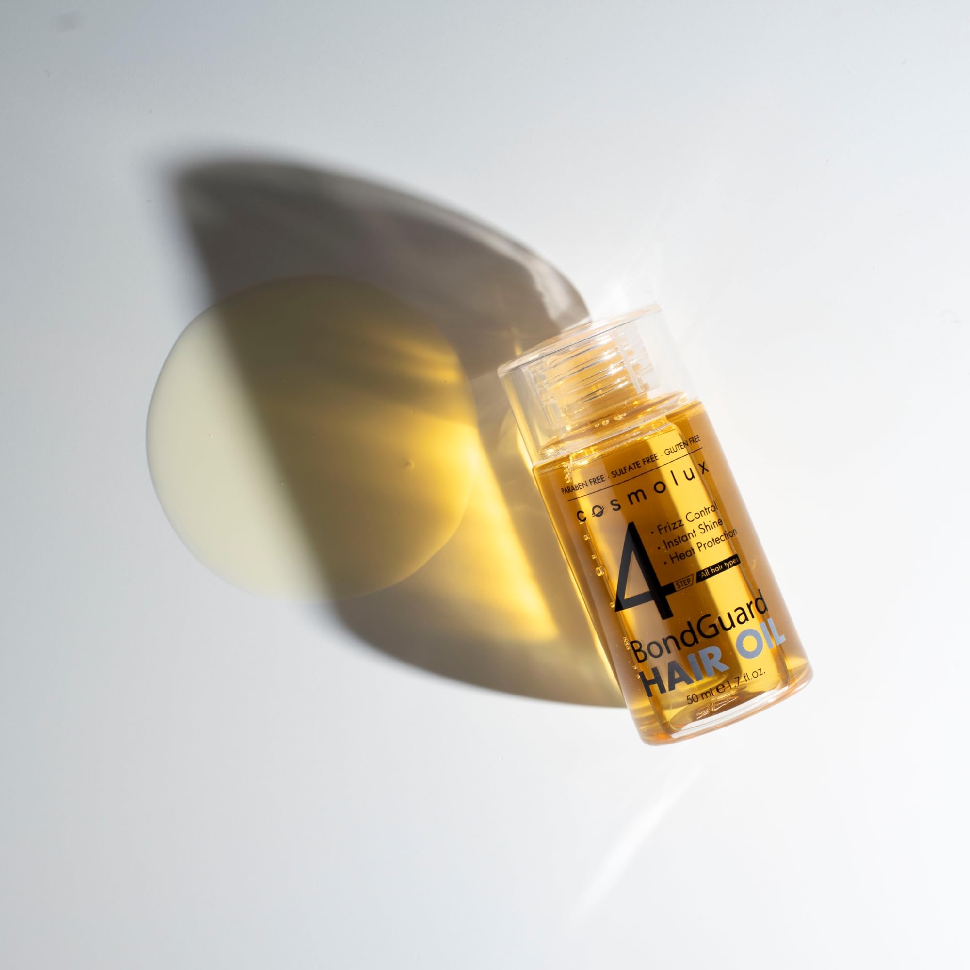 Cosmolux BondGuard travel-size tube beside a brush