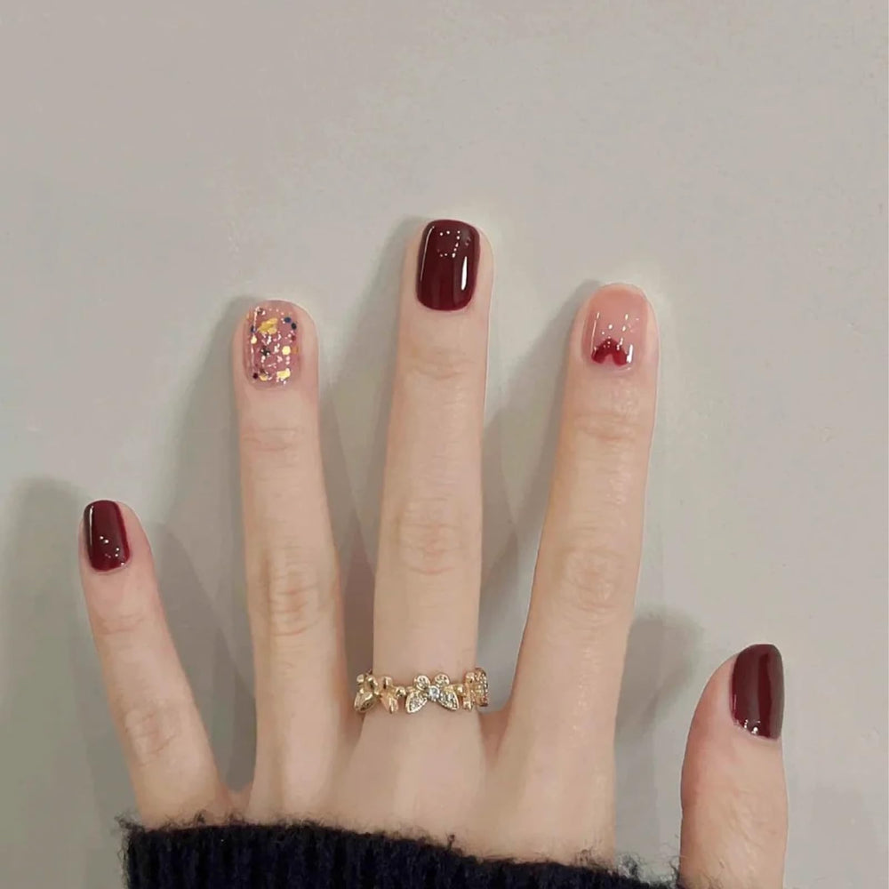 COSMOO Cherry Red Nail Polish application process shows smooth coat and even coverage.