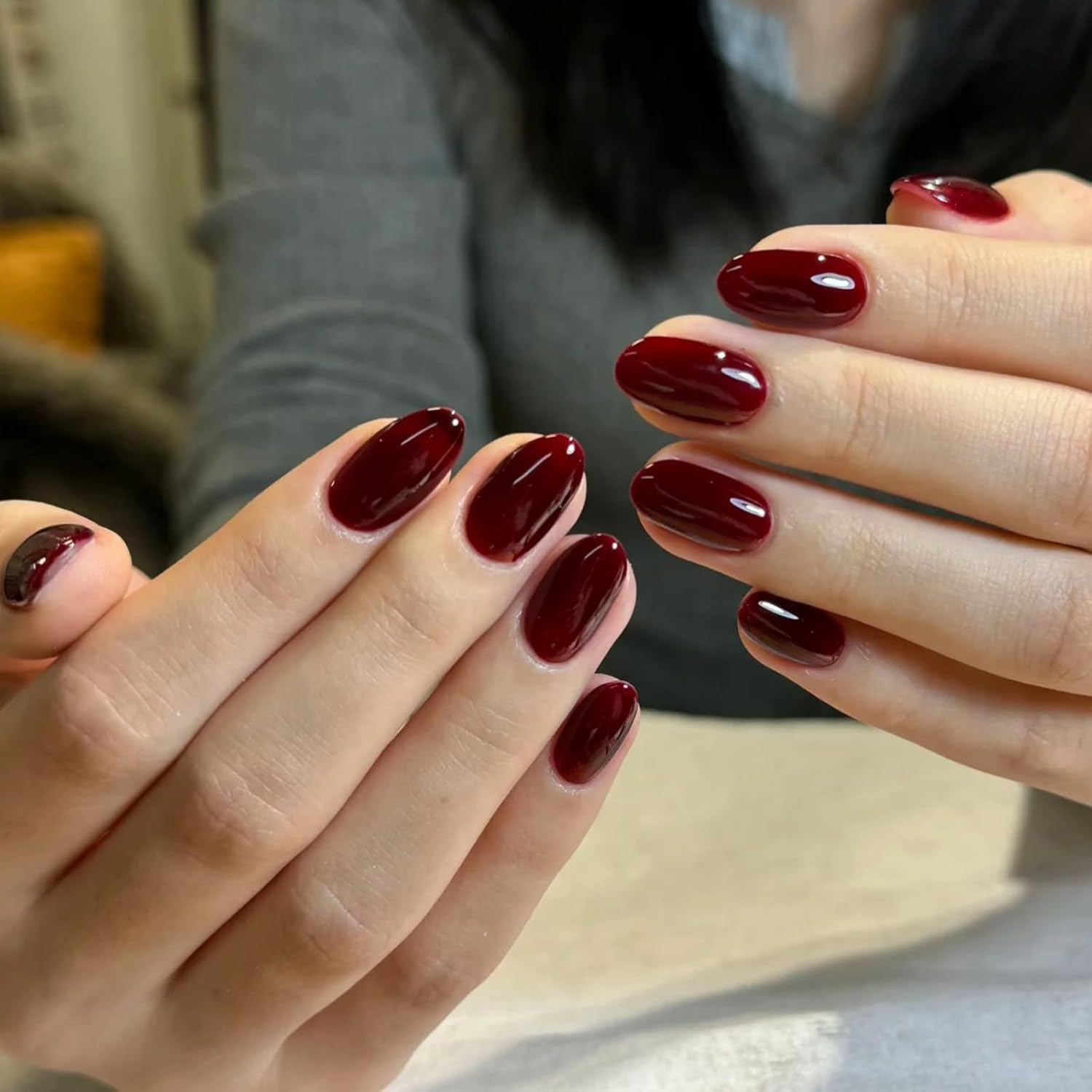 COSMOO Cherry Red Nail Polish brush stroke showing smooth color.