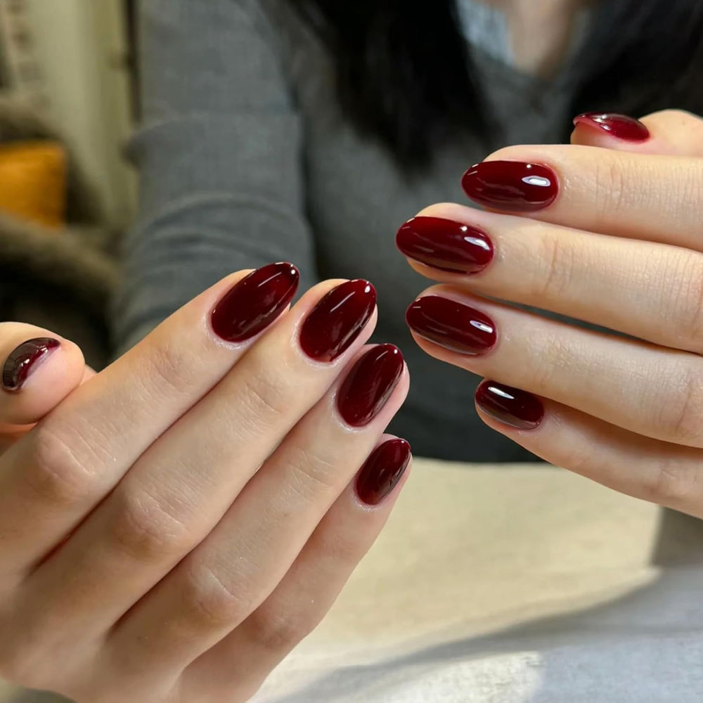 COSMOO Cherry Red Nail Polish brush stroke showing smooth color.