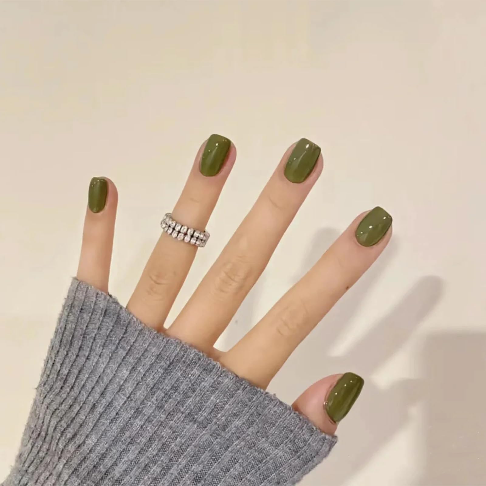 COSMOO nail polish brush applying olive shade for smooth, even coats