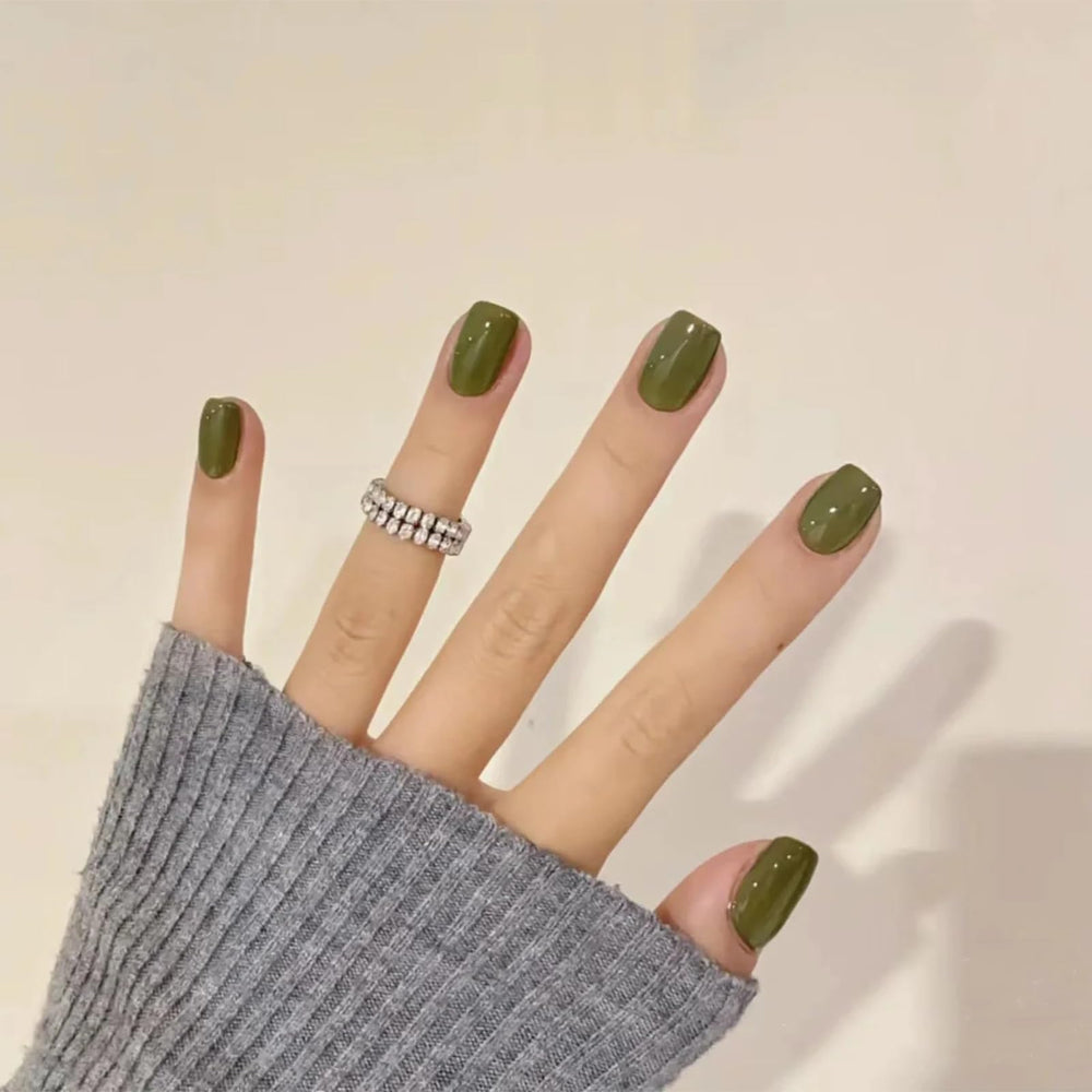 COSMOO nail polish brush applying olive shade for smooth, even coats