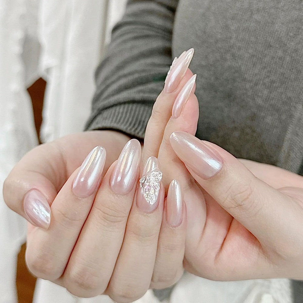 COSMOO Pearl Pink polish drying on a nail shows quick-dry timing.