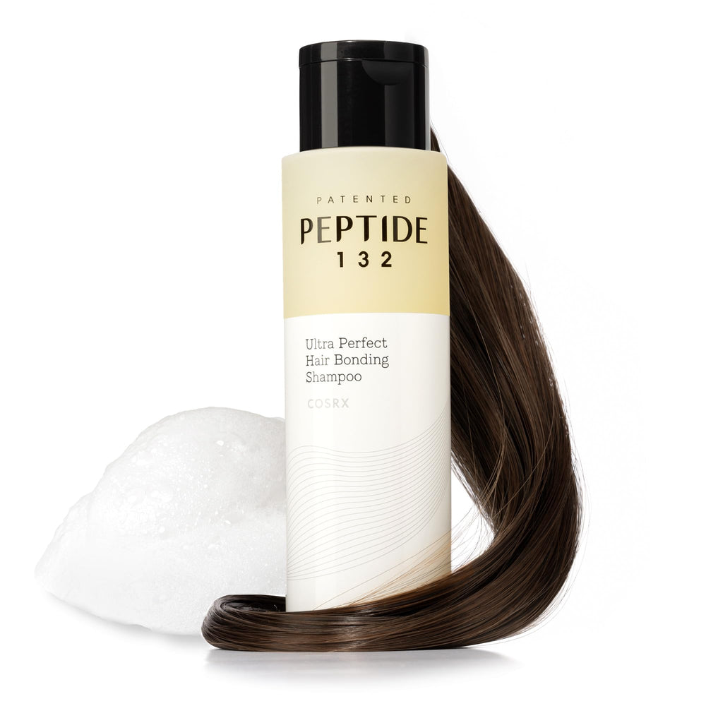 COSRX PEPTIDE-132 Shampoo bottle close-up showing clean branding for daily scalp care.