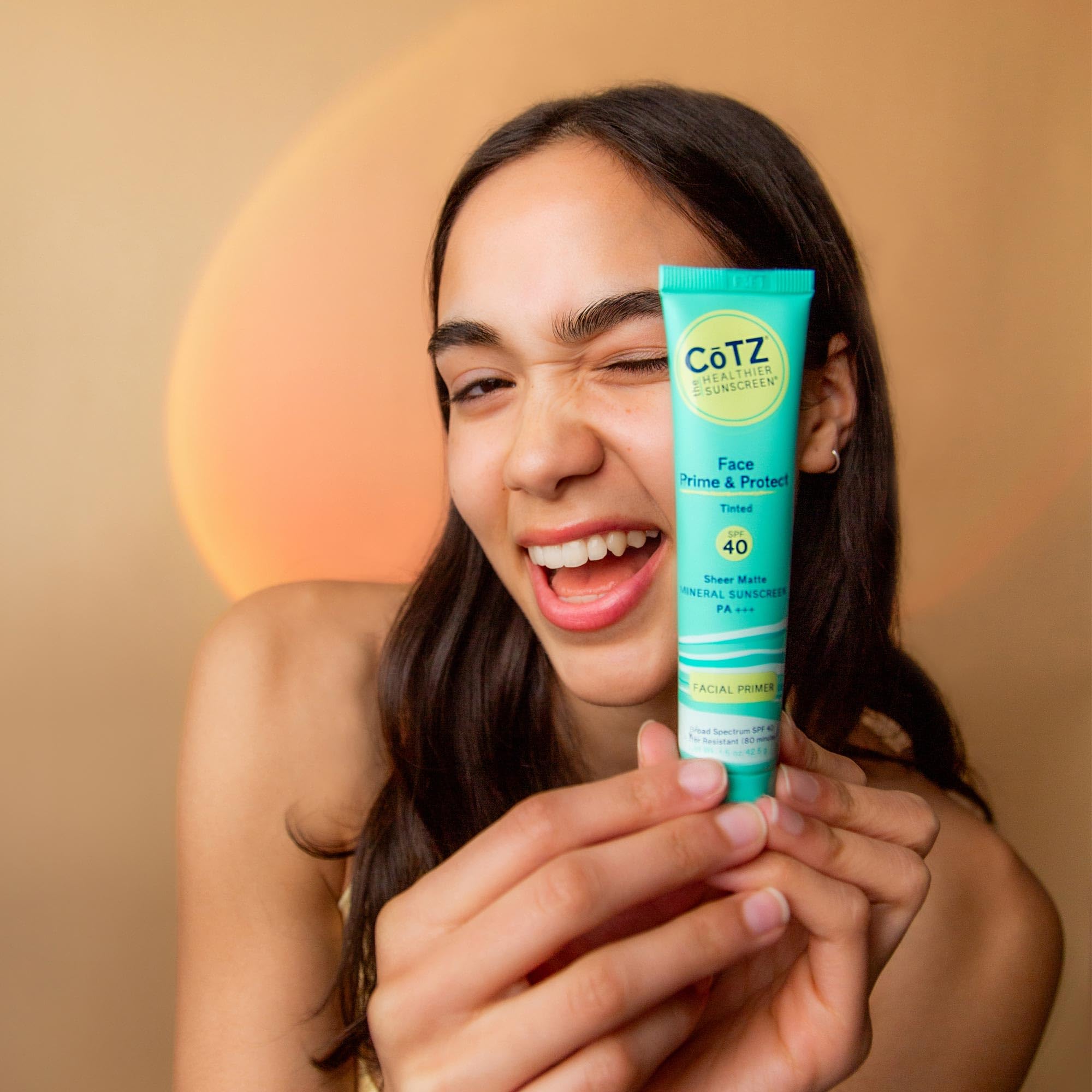 CoTZ Face Prime & Protect water-resistant mineral formula displayed on hand