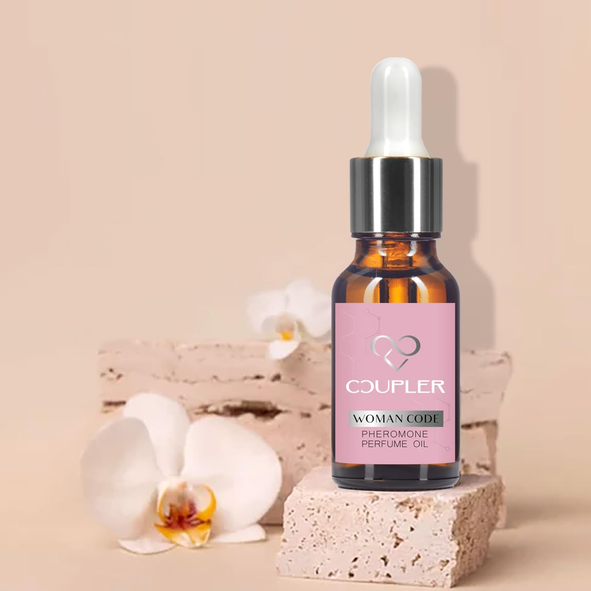 COUPLER pheromone oil women amber bottle closeup boosts natural allure