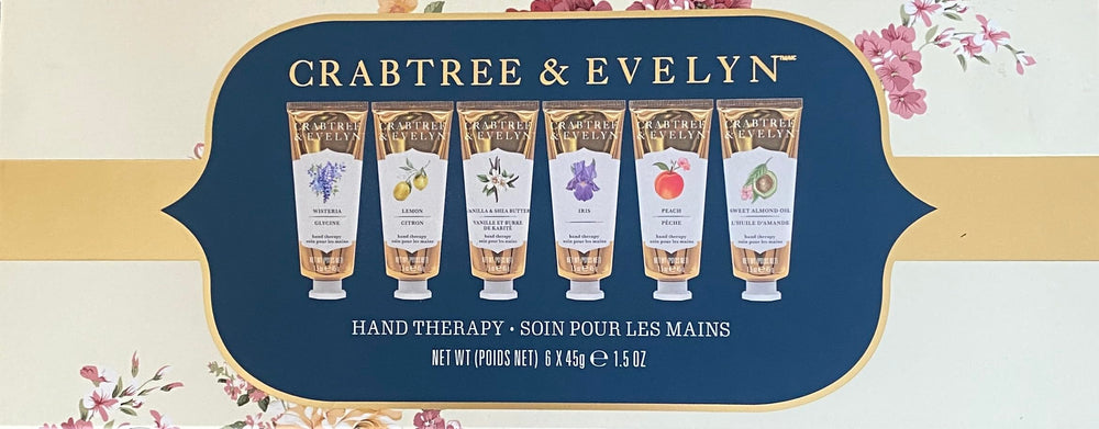 Crabtree & Evelyn Signature Hand Therapy box open lid, six travel-size creams ready for use.