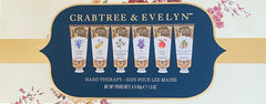Crabtree & Evelyn Signature Hand Therapy box open lid, six travel-size creams ready for use.
