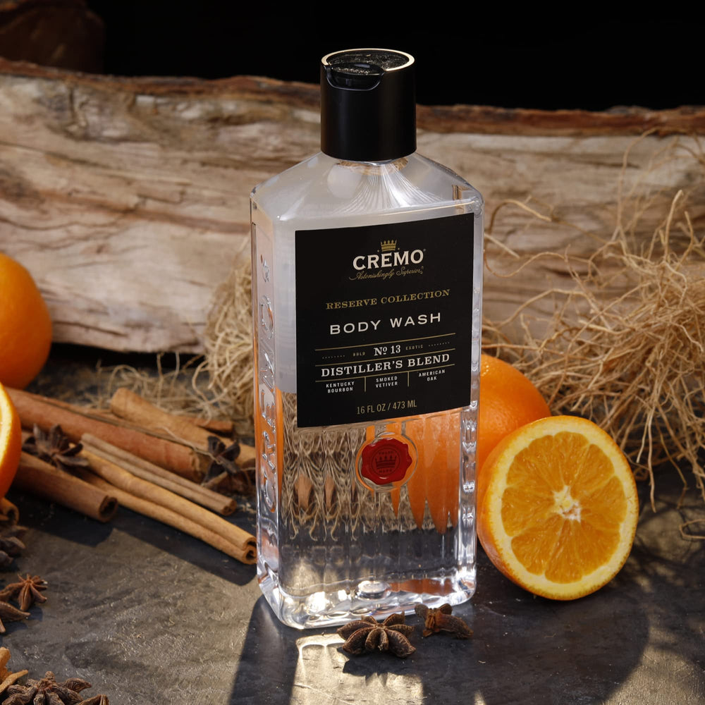 Cremo bottle on bathroom shelf with clean, masculine fragrance.