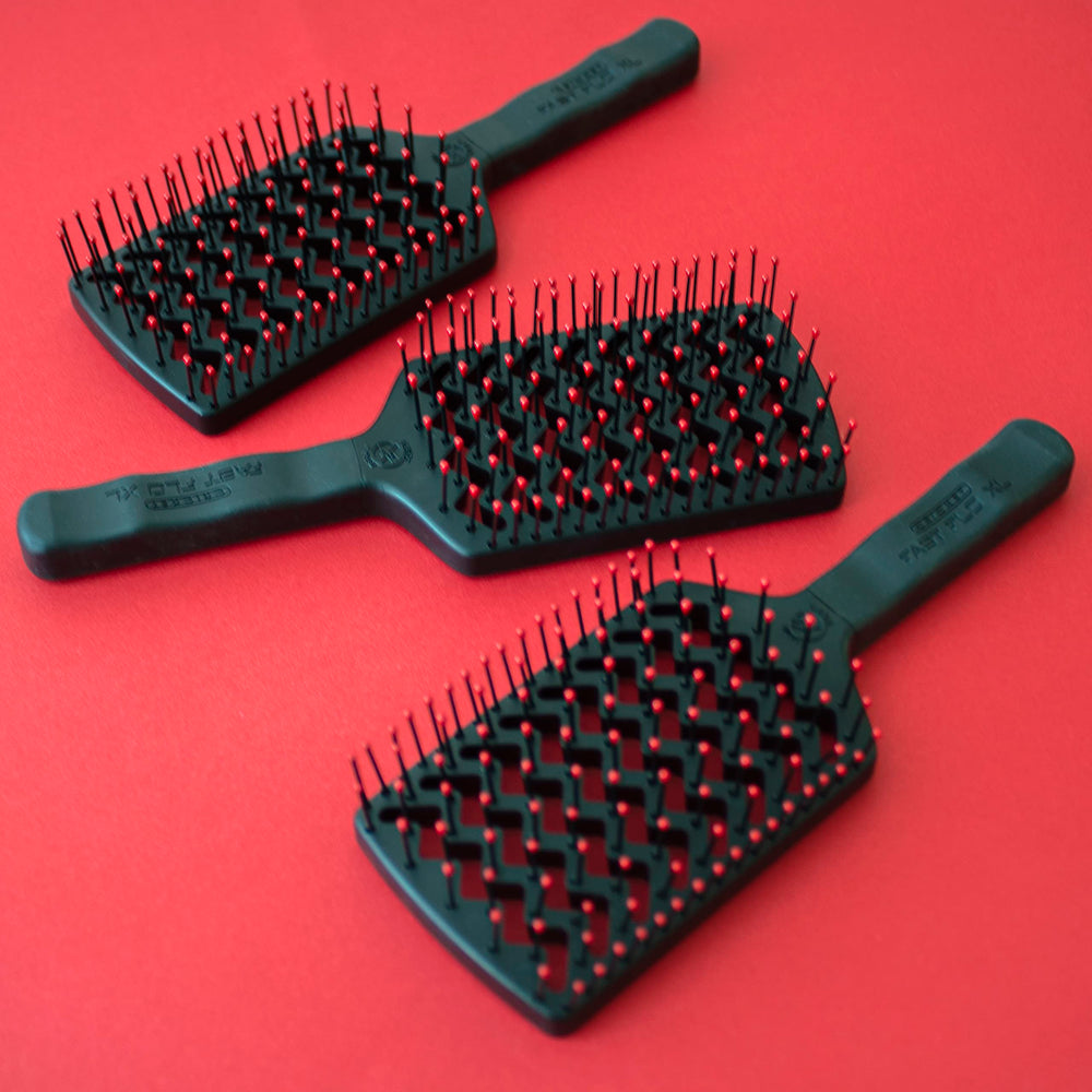 Cricket brush shown reducing flyaways during drying process