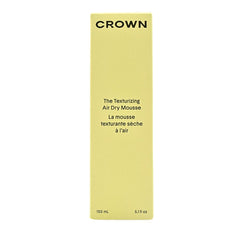 Crown Affair mousse foam close-up reveals lightweight formula for soft, tousled waves.